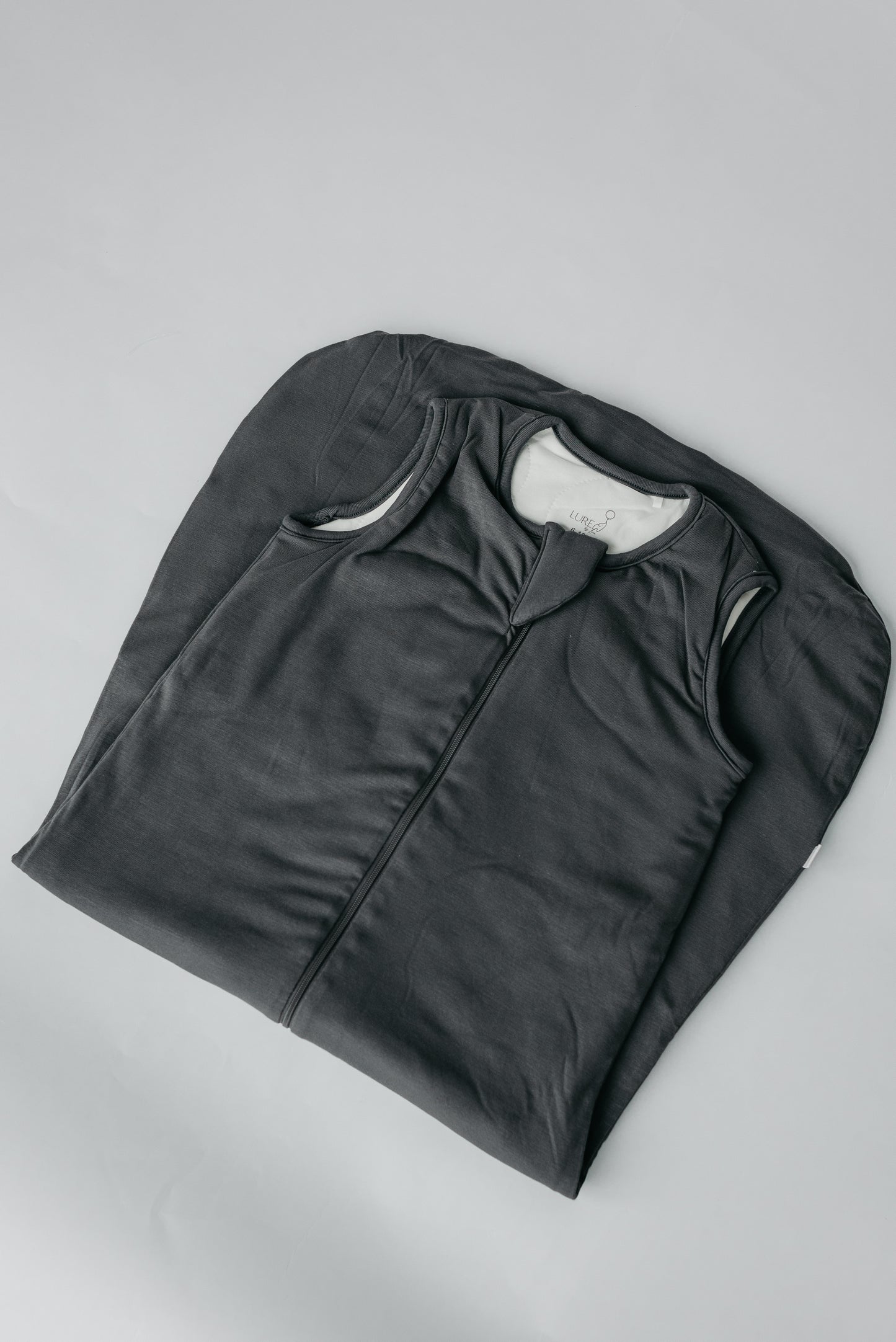 LURE by Lina Sleep Bag in Charcoal — bamboo viscose sleep sack with 1.0 TOG warmth and sustainable comfort for baby’s safe sleep