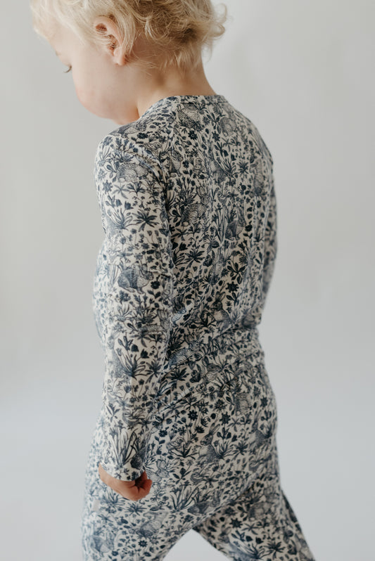 baby wearing grow with me pajamas made from bamboo fabric