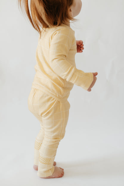 Flat lay of LURE by Lina Diaper Peek-a-Boo sleeper — breathable cotton baby sleepwear with two-way zipper and OEKO-TEX® certified fabric