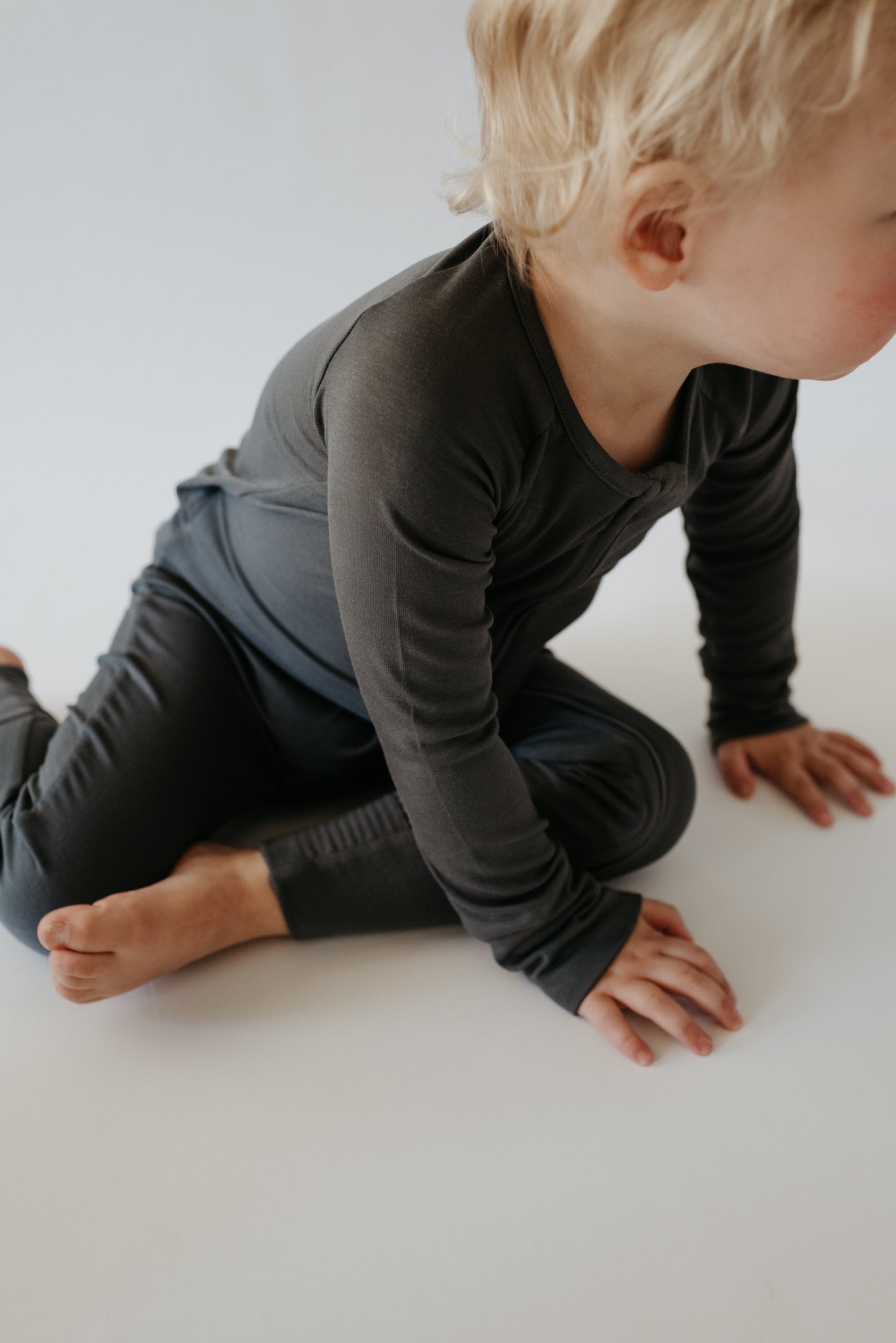 LURE by Lina — Essentials baby zip footie in Charcoal—neutral solid with Diaper Peek-a-Boo and convertible cuffs