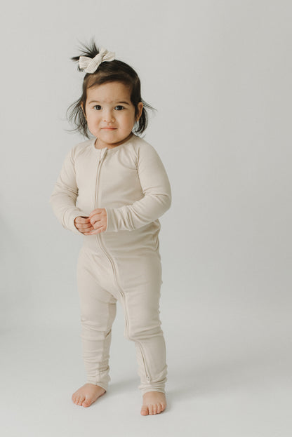 Sandstone Essentials footie—double-stitched neckline and Diaper Peek-a-Boo detail, LURE by Lina (close-up)