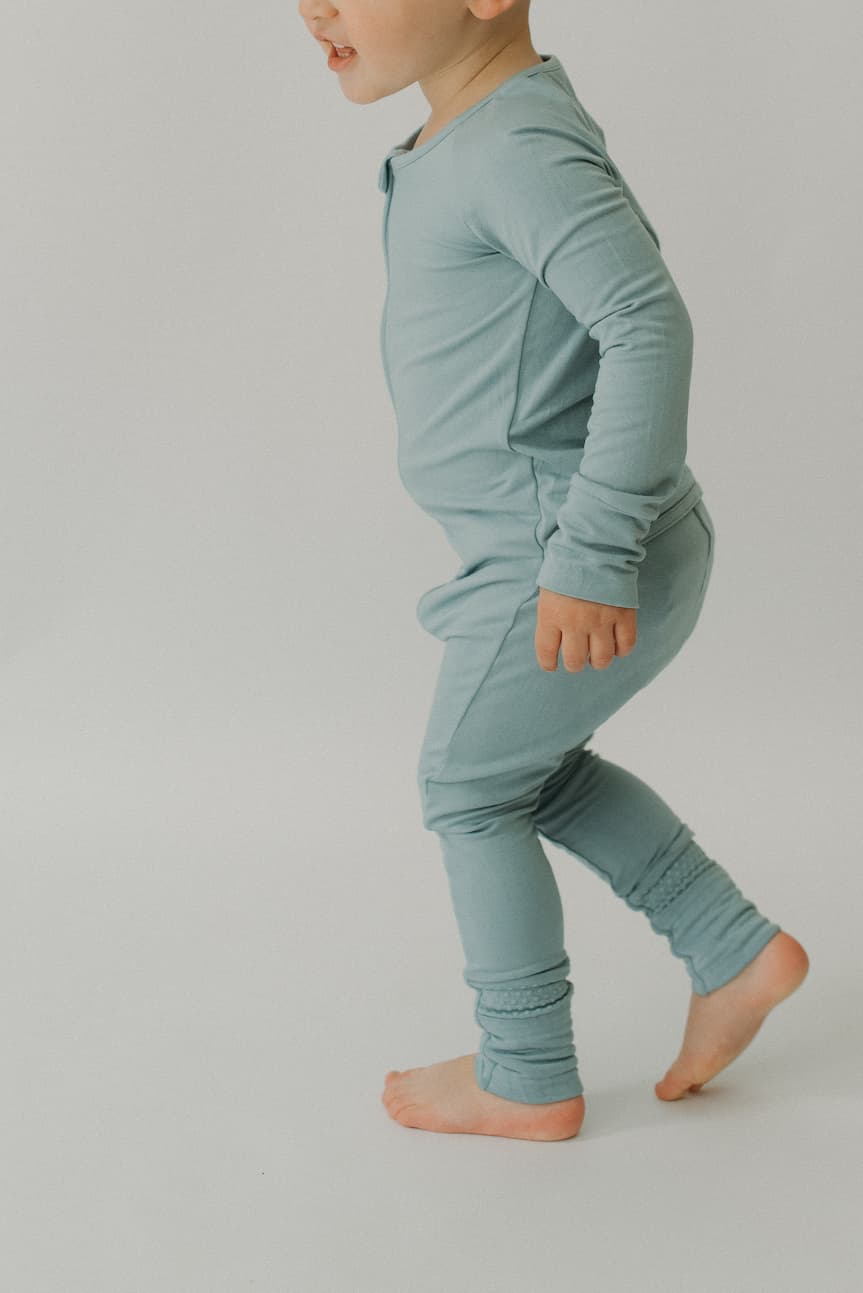 LURE by Lina — Essentials baby zip footie in Steel Blue—clean solid, Diaper Peek-a-Boo, convertible hands & feet