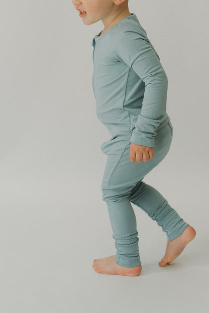 LURE by Lina — Essentials baby zip footie in Steel Blue—clean solid, Diaper Peek-a-Boo, convertible hands & feet