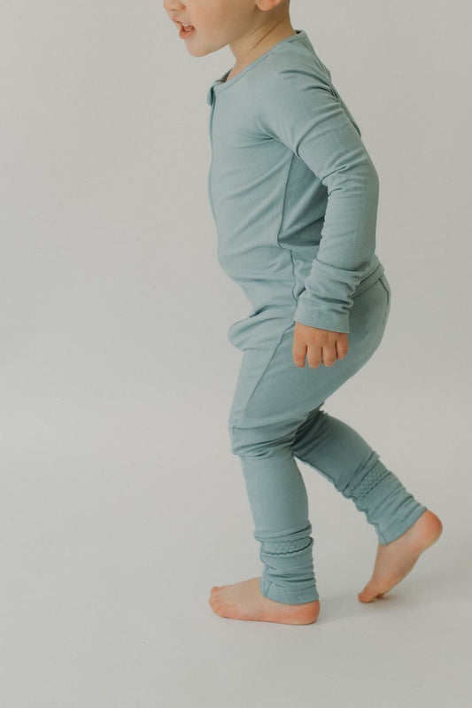 LURE by Lina — Essentials baby zip footie in Steel Blue—clean solid, Diaper Peek-a-Boo, convertible hands & feet