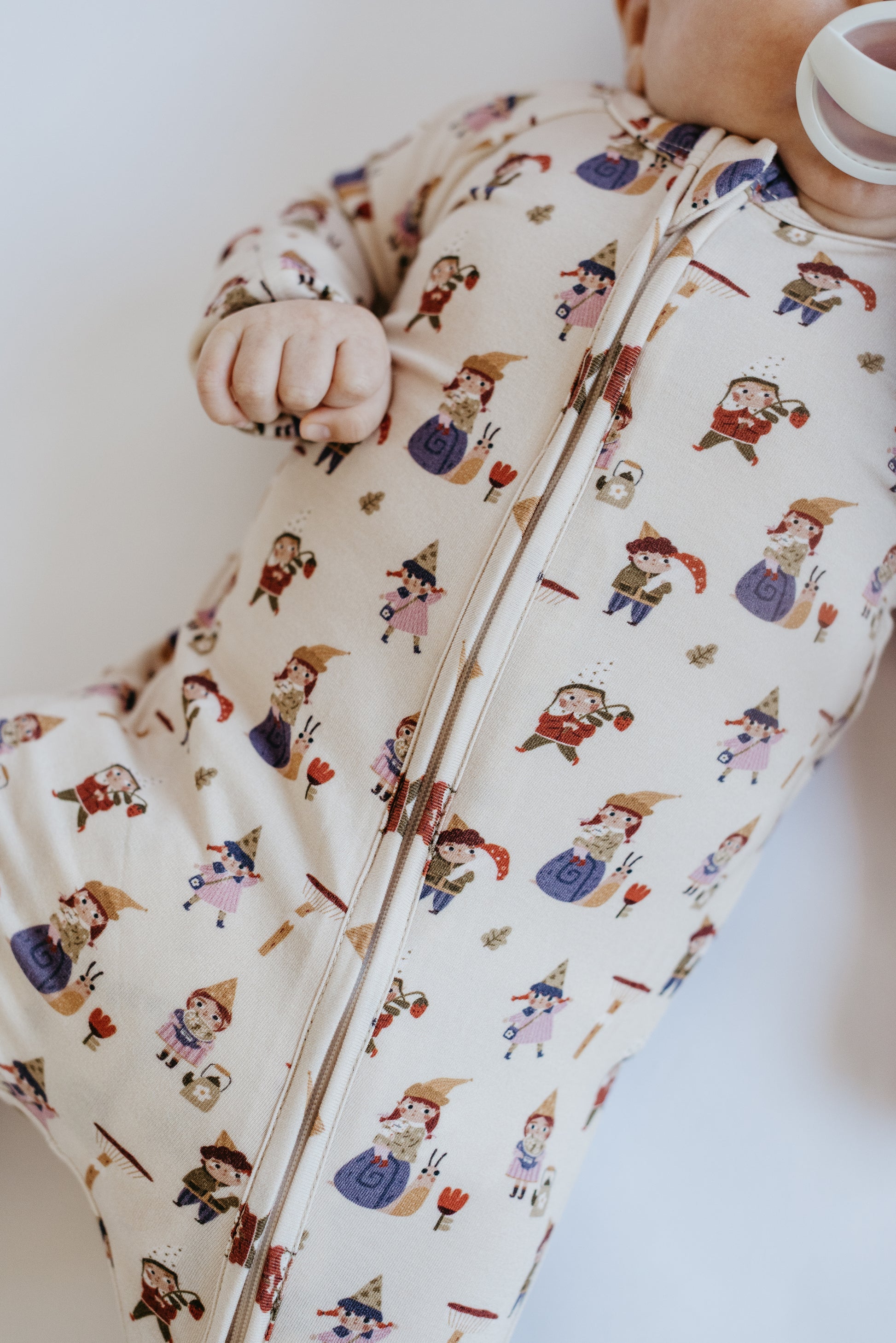 LURE by Lina Gnome Village baby one-piece in cream — pattern detail