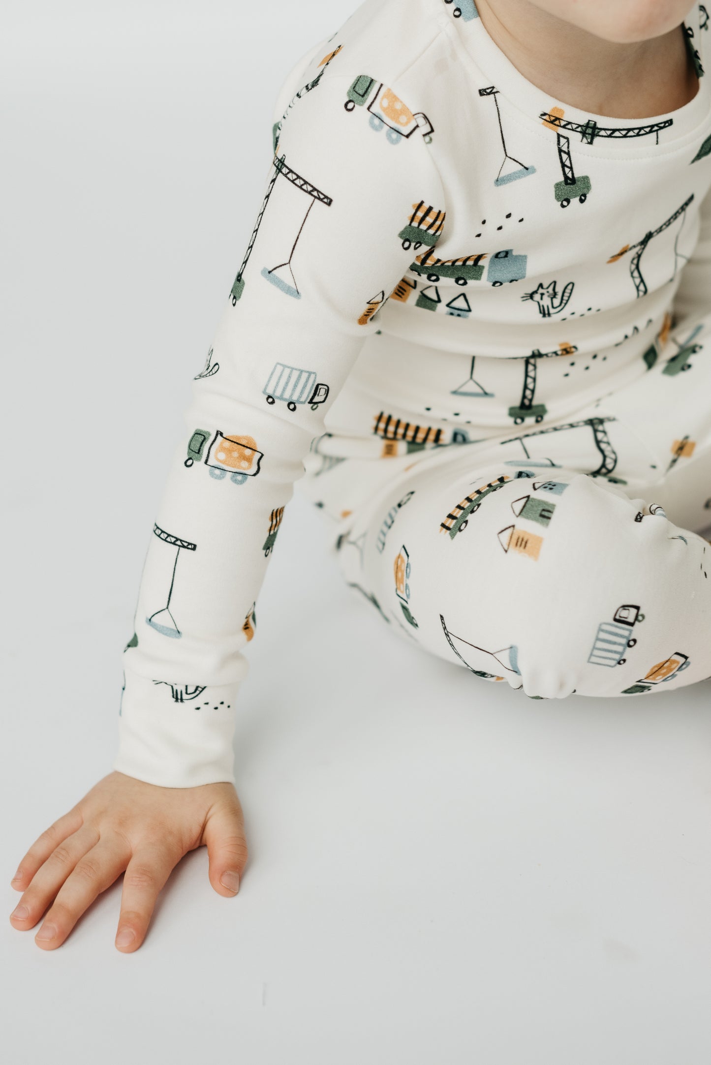 LURE by Lina Meow Construction baby sleeper featuring cats, plaid, and construction trucks — soft cotton blend pajamas with Diaper Peek-a-Boo design