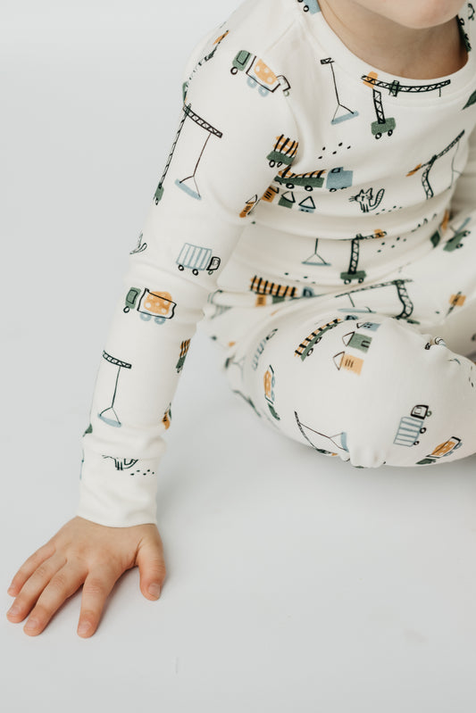 LURE by Lina Meow Construction baby sleeper featuring cats, plaid, and construction trucks — soft cotton blend pajamas with Diaper Peek-a-Boo design