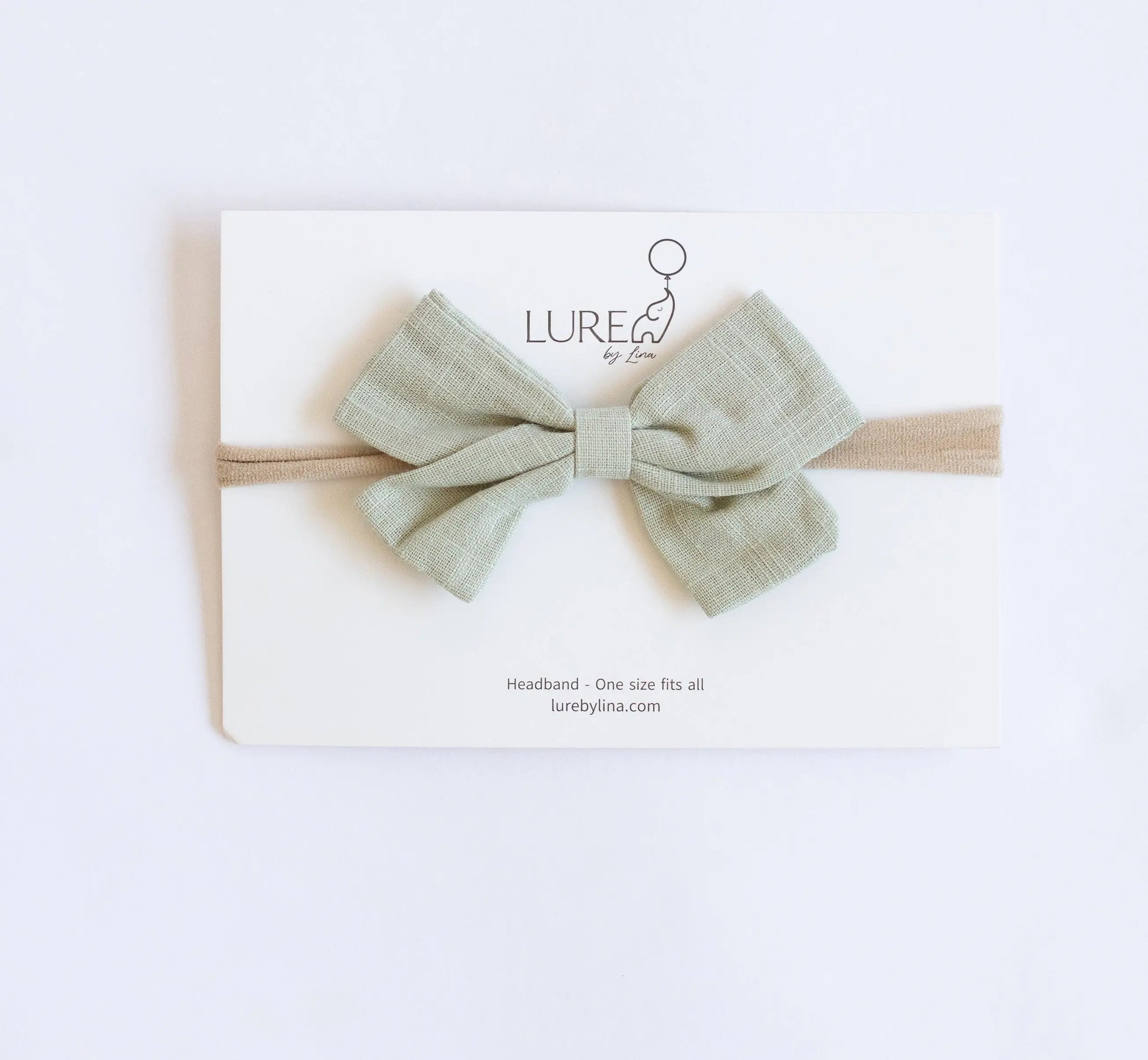 LURE by Lina Organic Cotton Bow in Pistachio — lightweight green baby bow made with organic cotton knit and water-based dyes