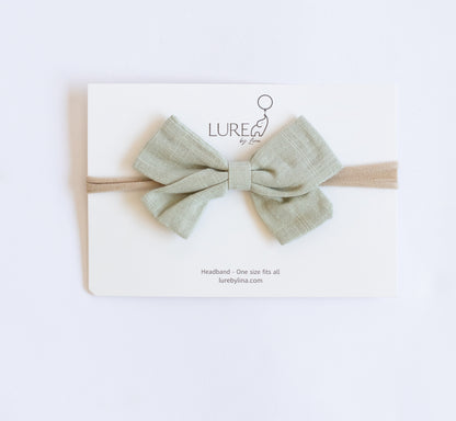 LURE by Lina Organic Cotton Bow in Pistachio — lightweight green baby bow made with organic cotton knit and water-based dyes