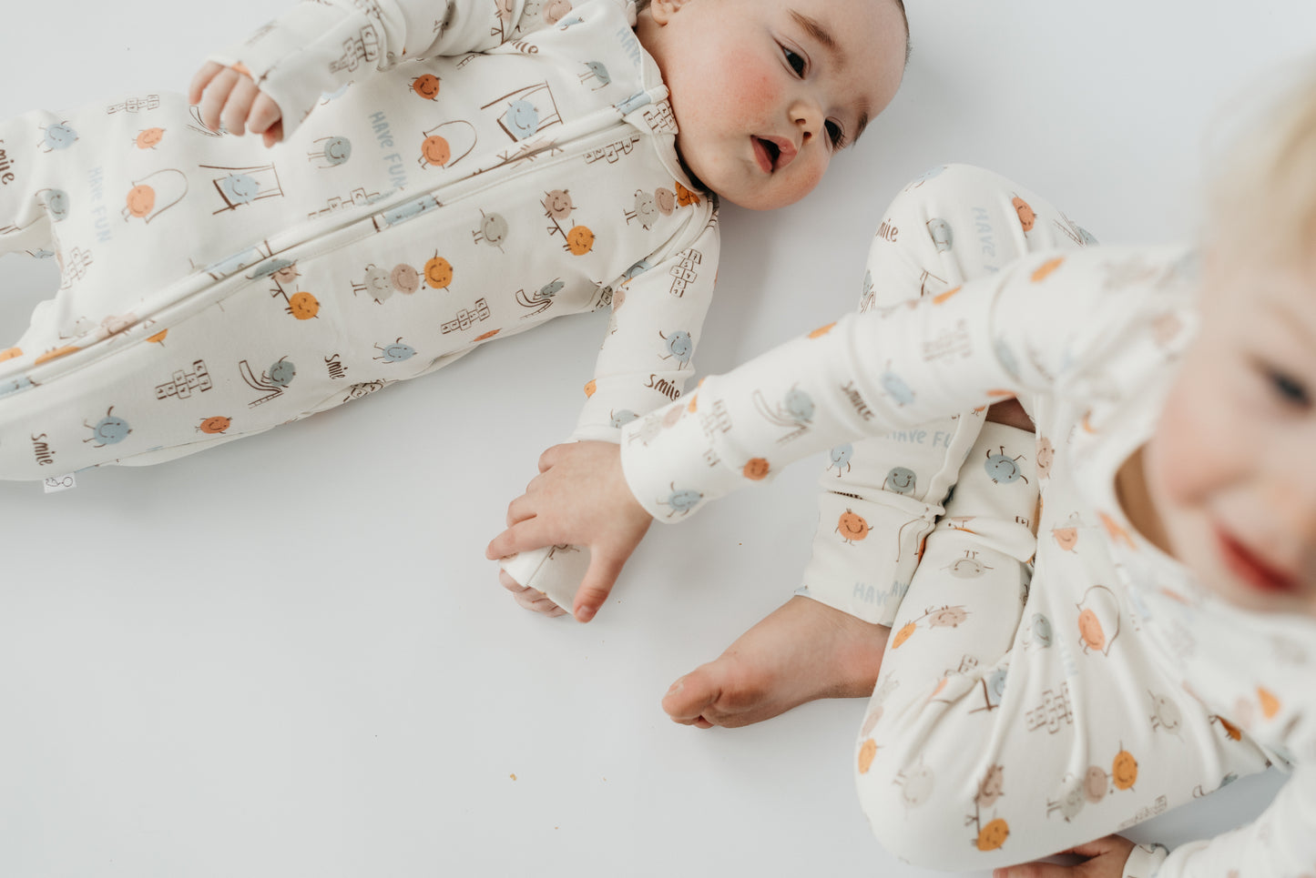 Baby and toddler wearing LURE by Lina Play Time matching pajamas — cozy cotton blend sleepwear with playful print